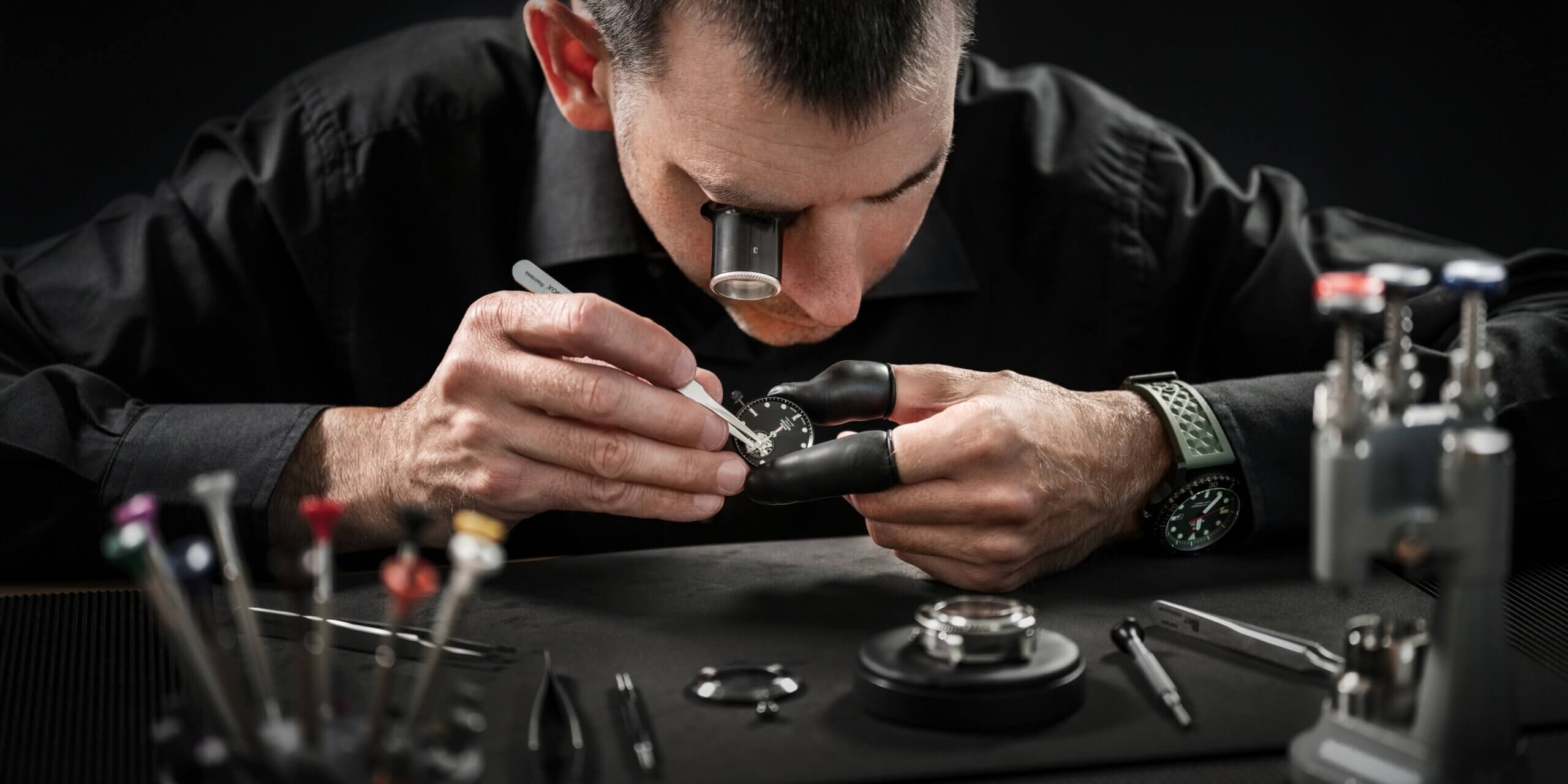 Swiss watchmaker assembling a watch movement – hand‑crafted Swiss Military by Chrono timepiece made in Switzerland.